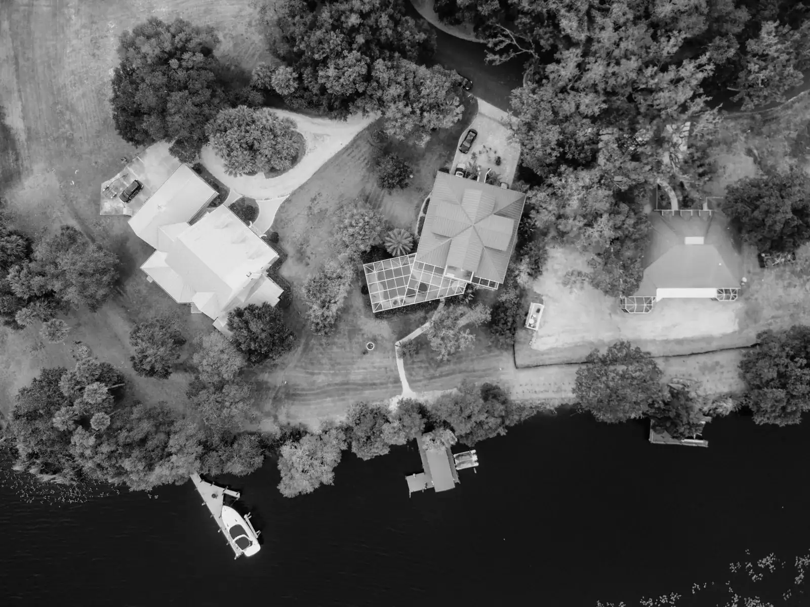 River house with a dock and boats