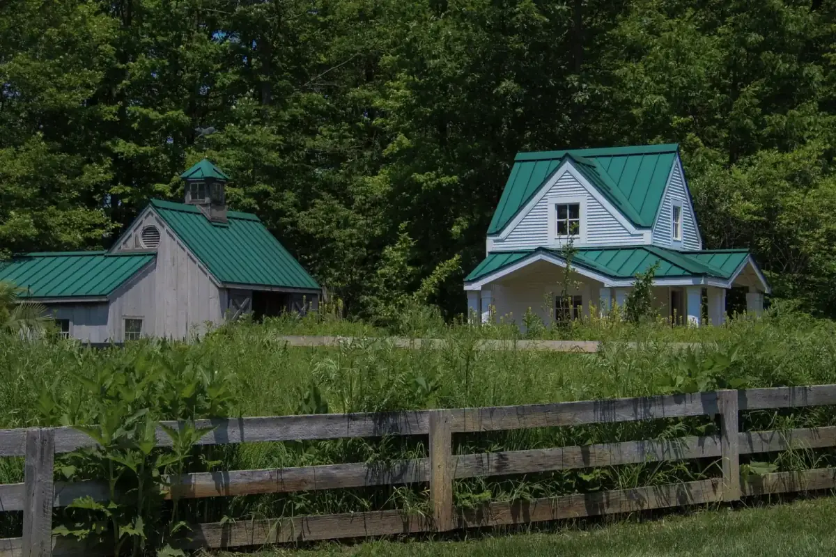 Rural farmhouse and barn on a large property