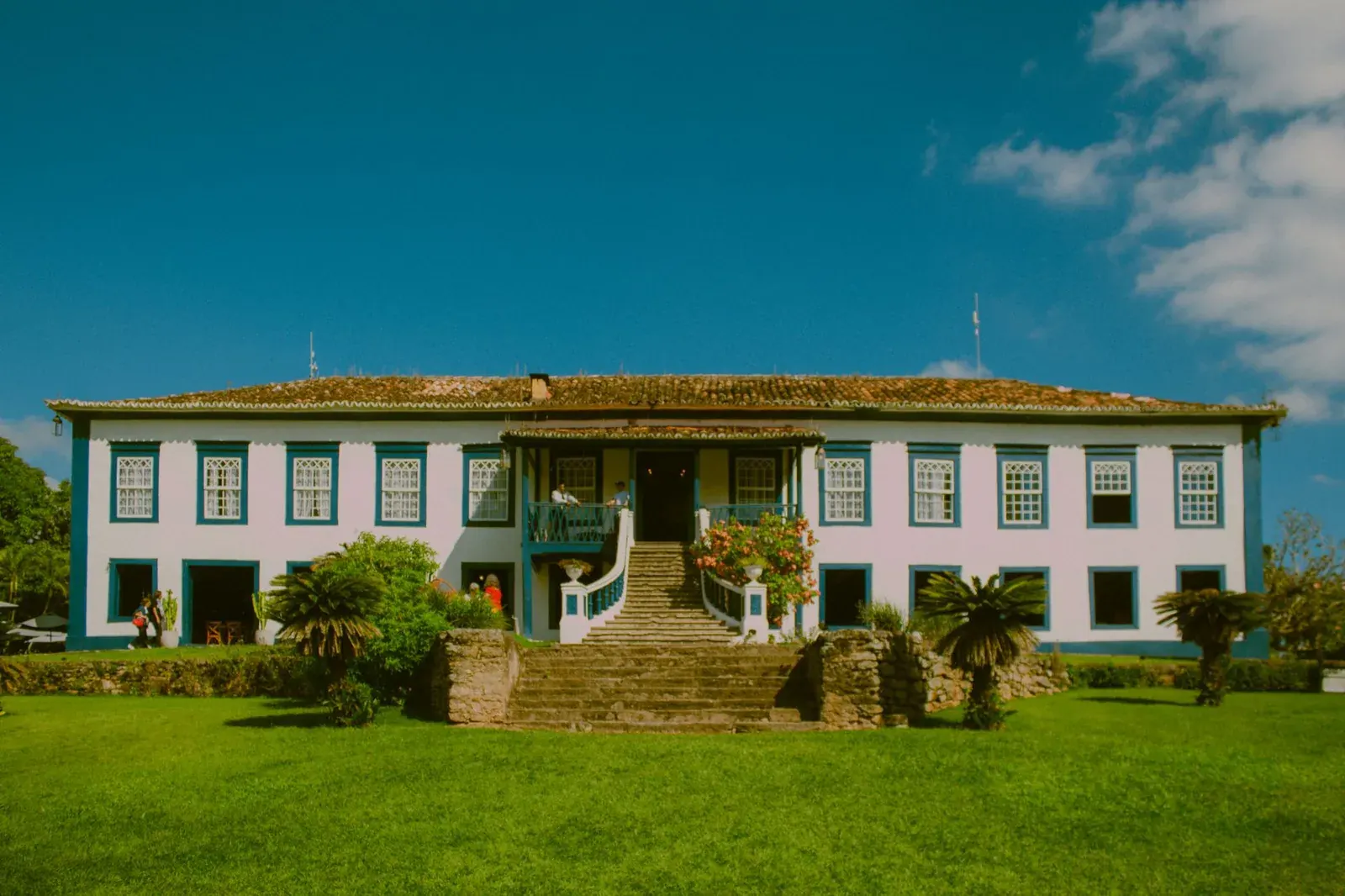Center-hall colonial house with a wide front lawn