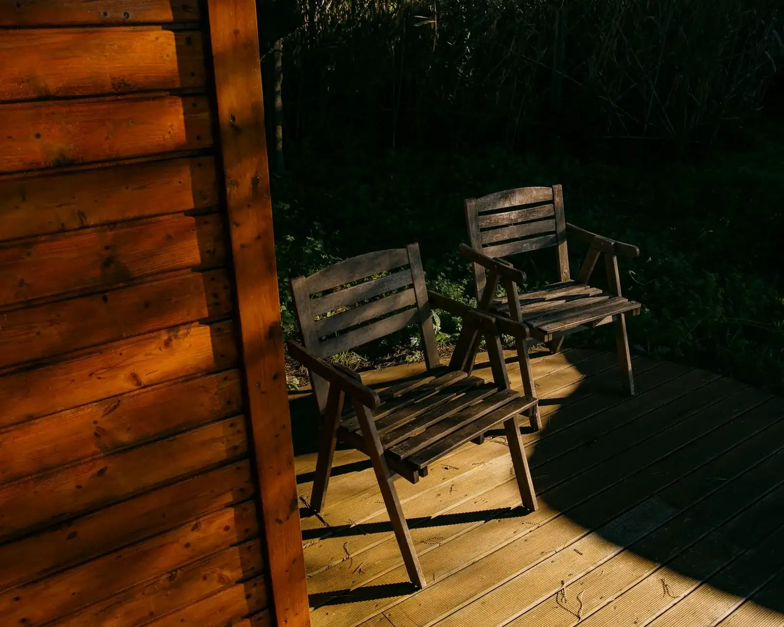 Weathered wooden deck boards on a backyard deck